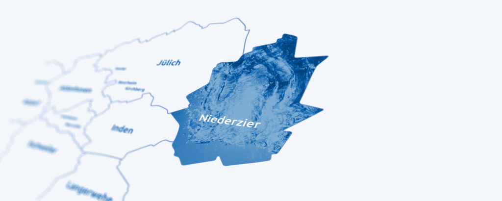 Karte von Deutschland mit blau markiertem Niederzier, Wassertextur und umliegenden Orten Jülich und Inden.